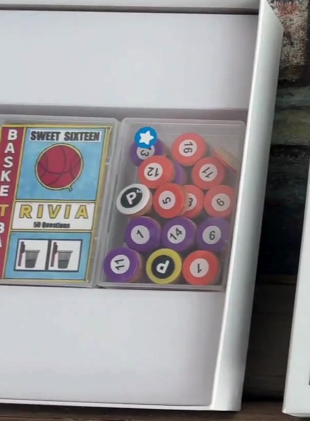 Sweet 16 game components: numbered discs and basketball trivia cards
