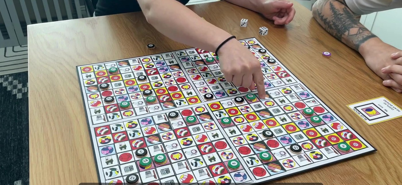 The Sweet 16 board laid out on a table mid-game
